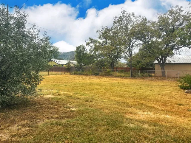 a view of lake with green space