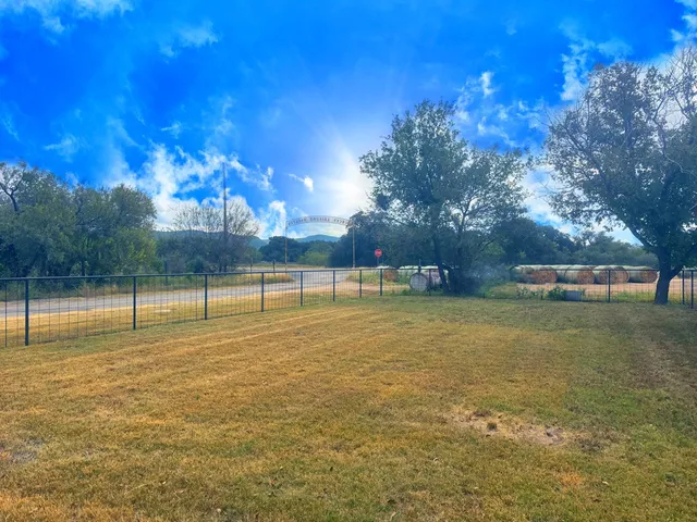 a view of a swimming pool with a patio