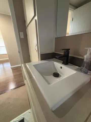a utility room with sink dryer and washer