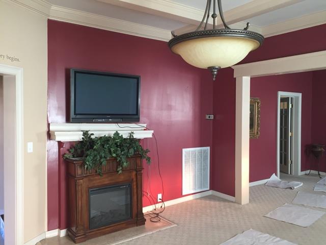 2705 Water Valley Road Santa Fe, TN 38482 - Photo 16 of 27 a living room with a fireplace and a flat screen tv