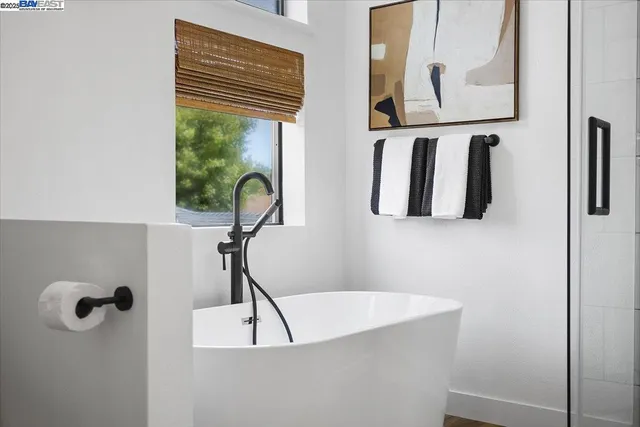 a bathroom with a sink a mirror and a shower