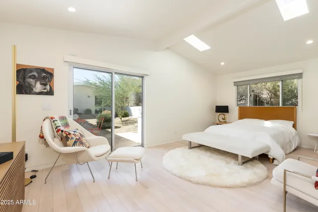 a bedroom with a bed and a couch