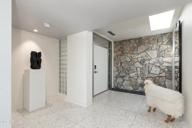 a bathroom with a shower and a sink