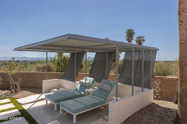 a bedroom with a bed and glass door