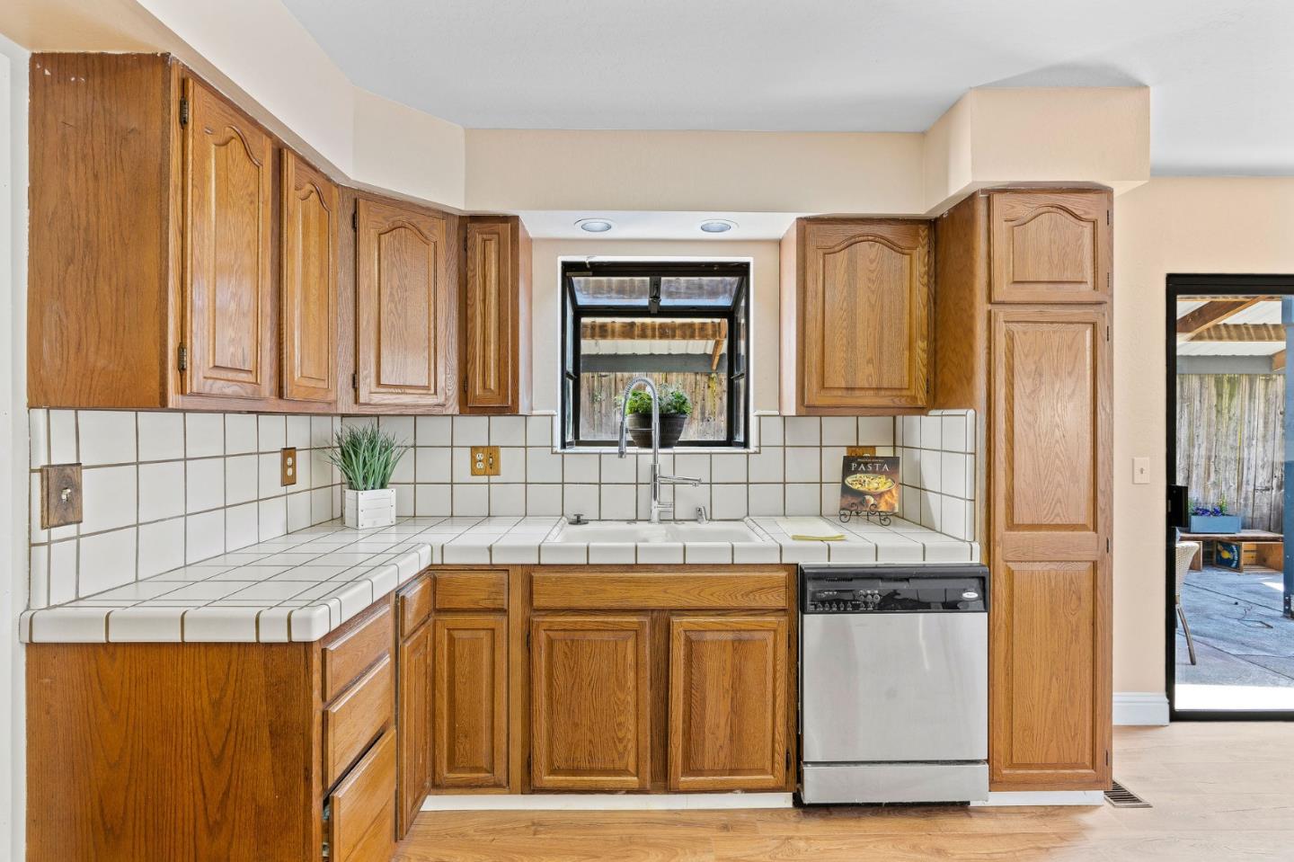 276 Hames Road Watsonville, CA 95076 - Photo 18 of 43 a kitchen with stainless steel appliances granite countertop a sink stove and refrigerator