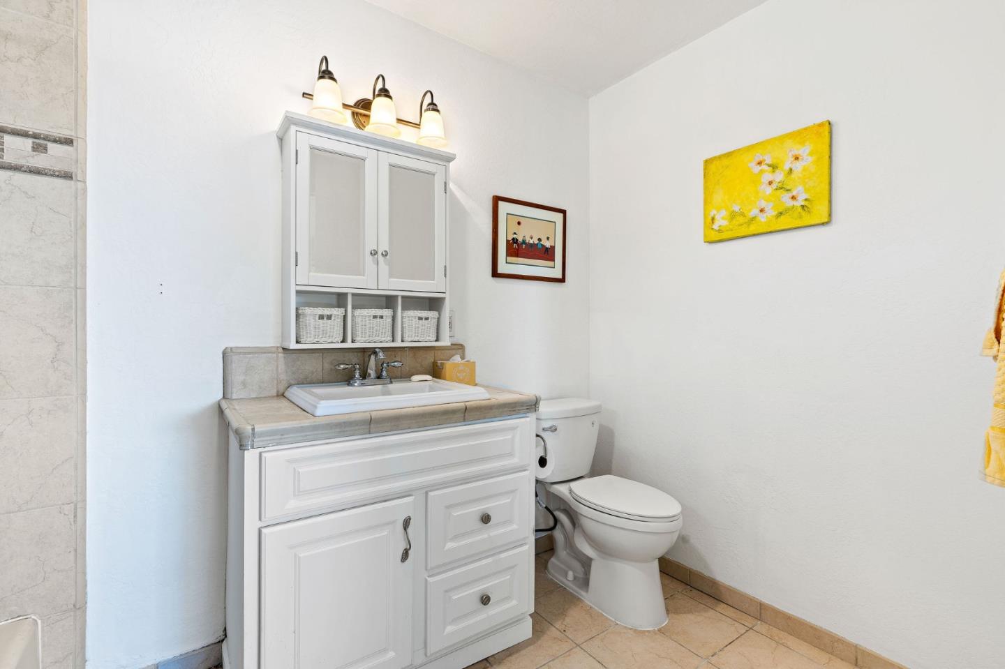 276 Hames Road Watsonville, CA 95076 - Photo 23 of 43 a bathroom with a toilet a sink and mirror