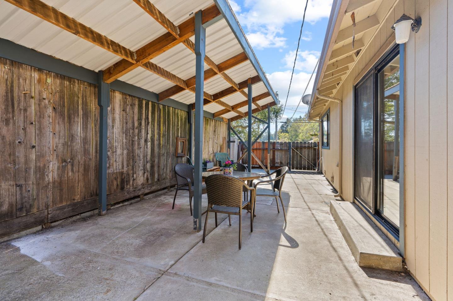 276 Hames Road Watsonville, CA 95076 - Photo 30 of 43 a view of a patio with a table and chairs