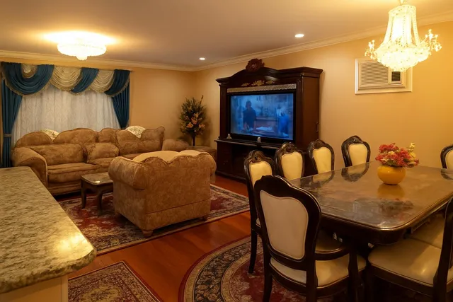 a living room with furniture and a rug