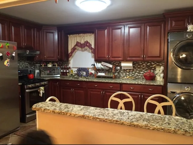 a kitchen with wooden cabinets and a sink