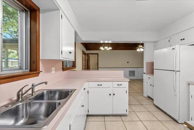 a kitchen with a sink stove and refrigerator
