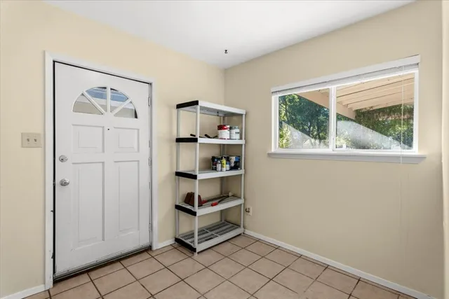 a view of a livingroom with shelves