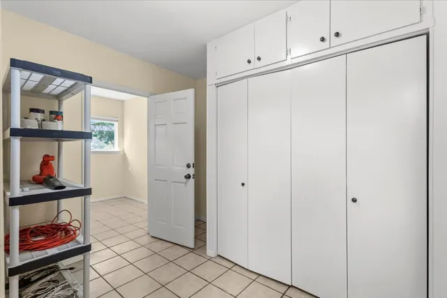 a view of room with painting on the wall