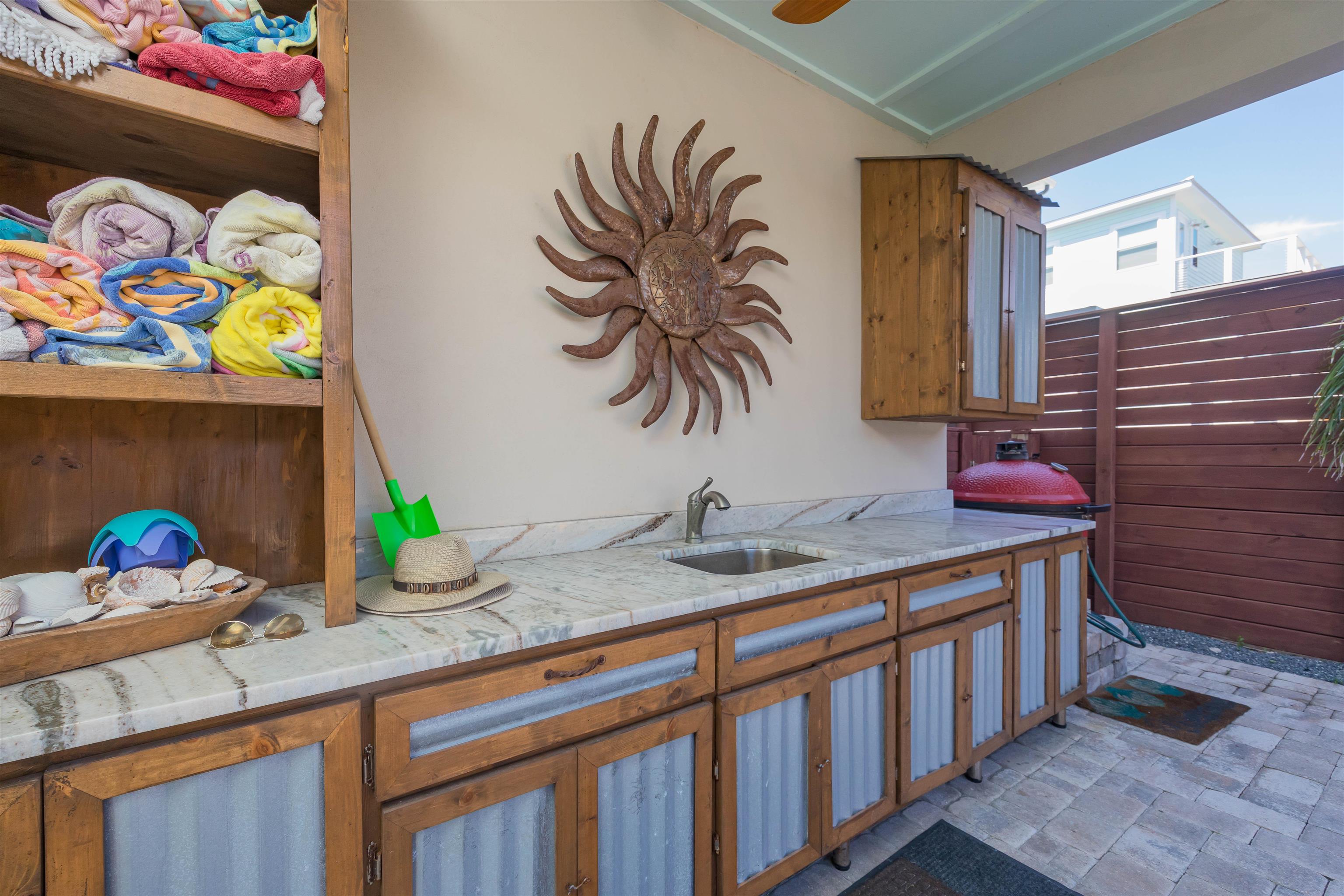 10 5th Street St. Augustine Beach, FL 32080 - Photo 13 of 49 a bathroom with a sink a vanity and wooden floor