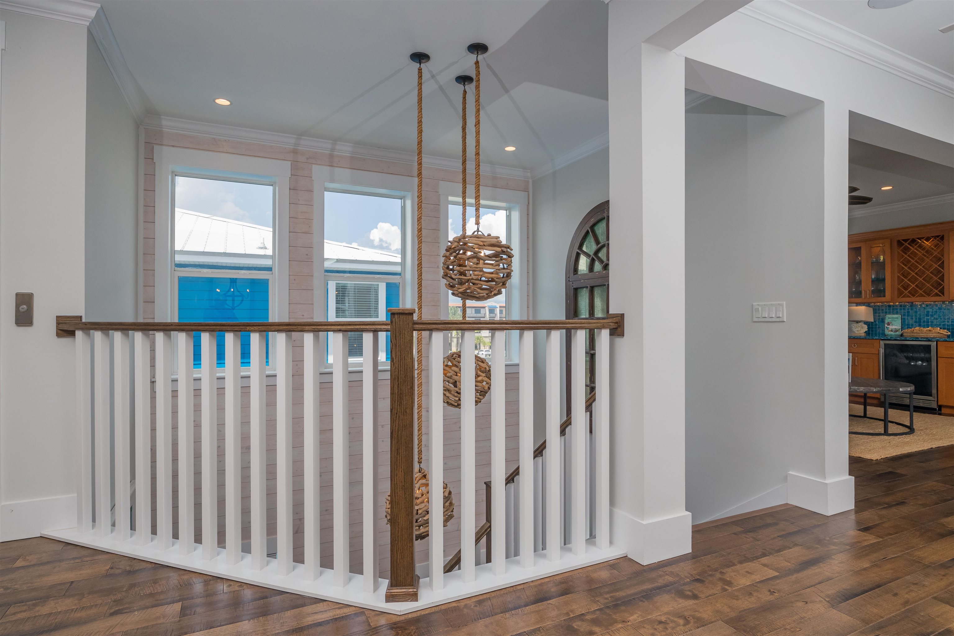 10 5th Street St. Augustine Beach, FL 32080 - Photo 16 of 49 a view of staircase with wooden floor
