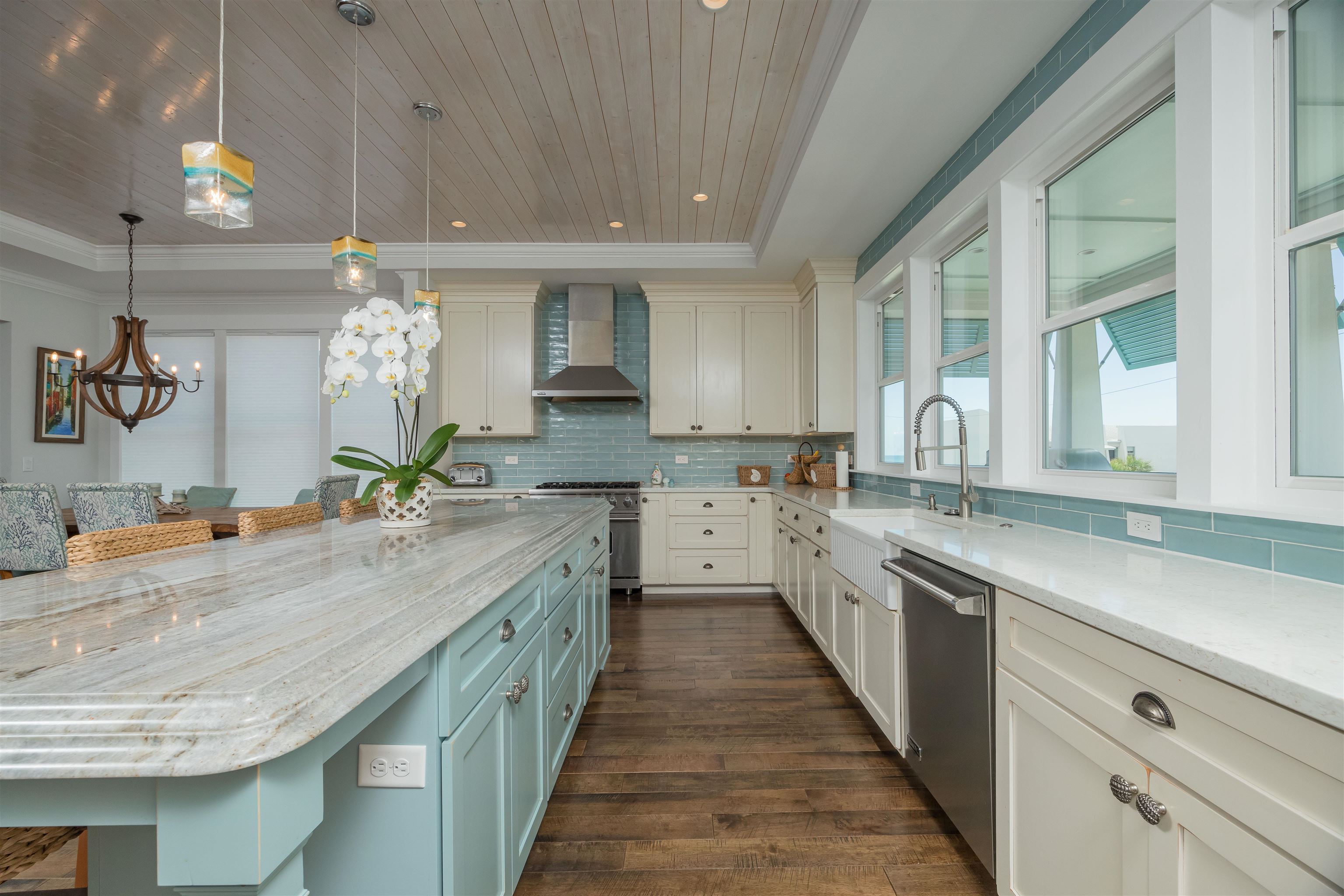 10 5th Street St. Augustine Beach, FL 32080 - Photo 18 of 49 a large kitchen with a sink and cabinets