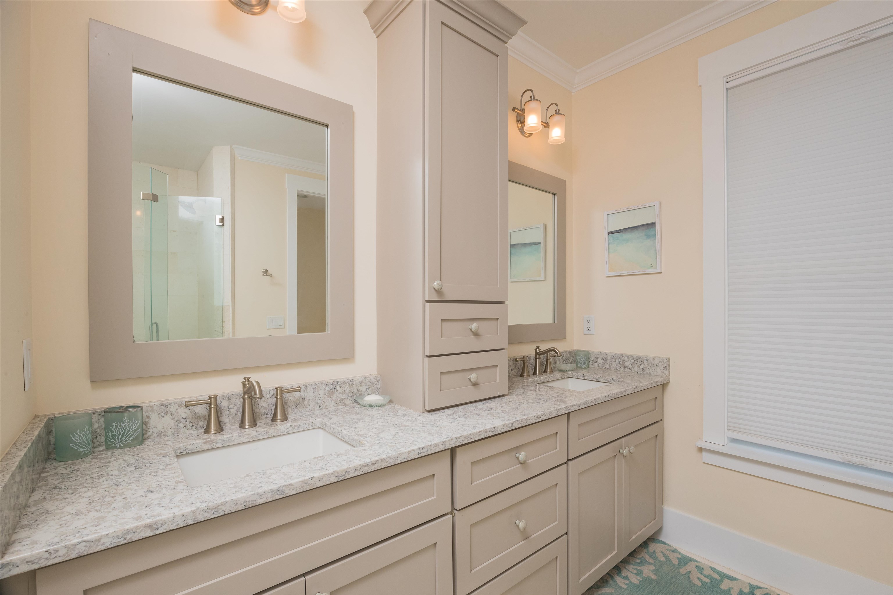 10 5th Street St. Augustine Beach, FL 32080 - Photo 32 of 49 a bathroom with double sink and a mirror