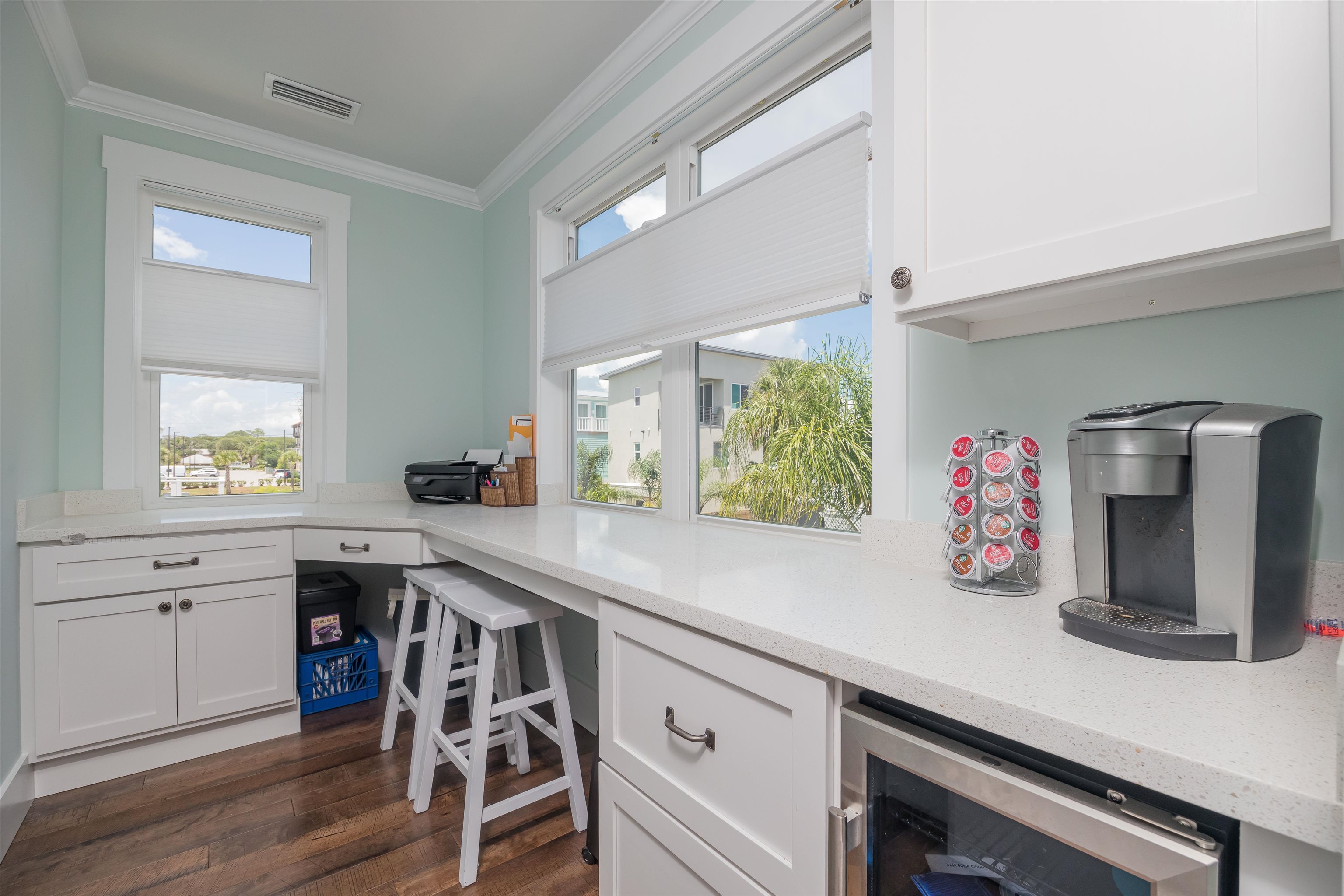 10 5th Street St. Augustine Beach, FL 32080 - Photo 34 of 49 a kitchen with stainless steel appliances white cabinets and wooden floors