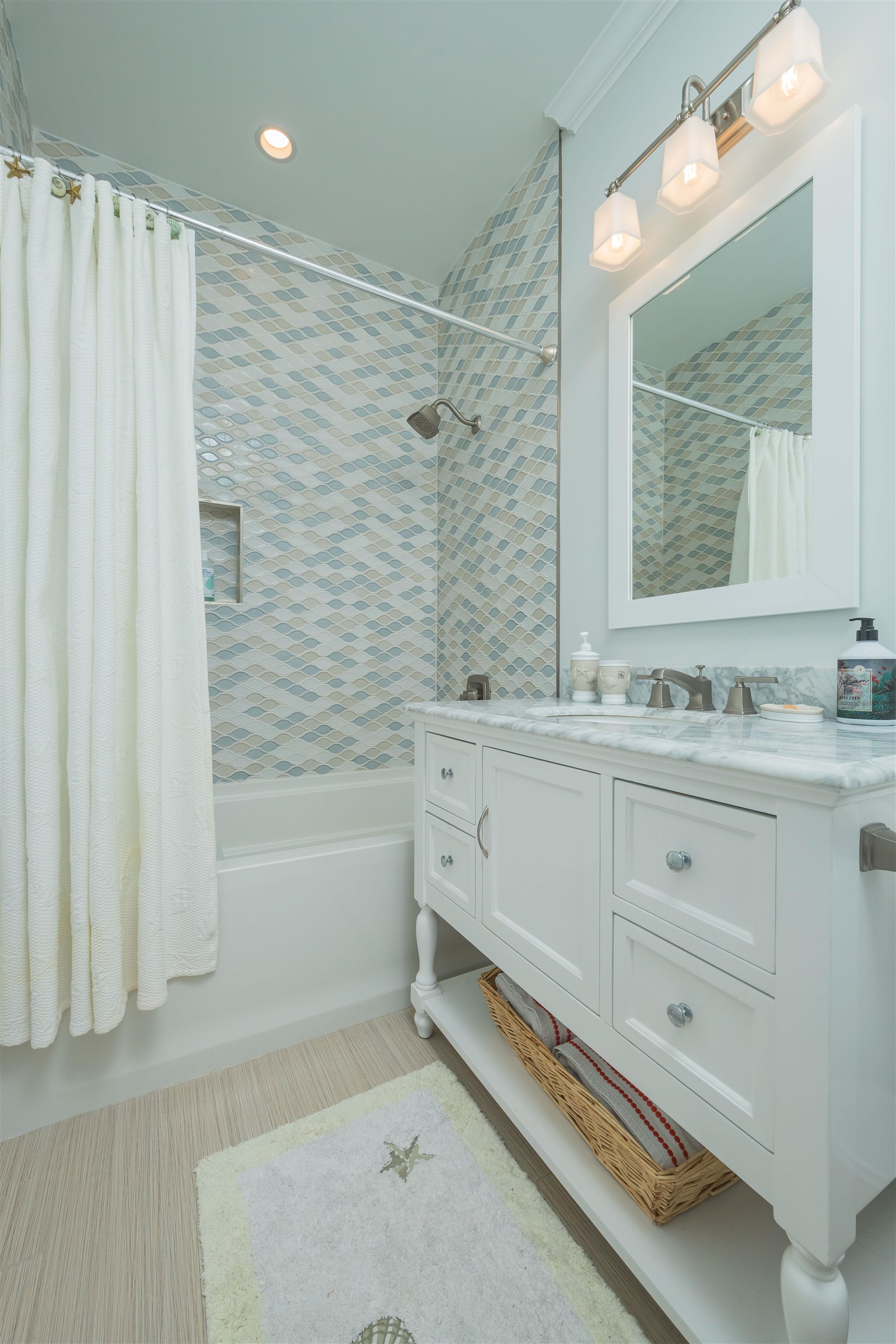 10 5th Street St. Augustine Beach, FL 32080 - Photo 36 of 49 a bathroom with a sink double vanity and a bathtub