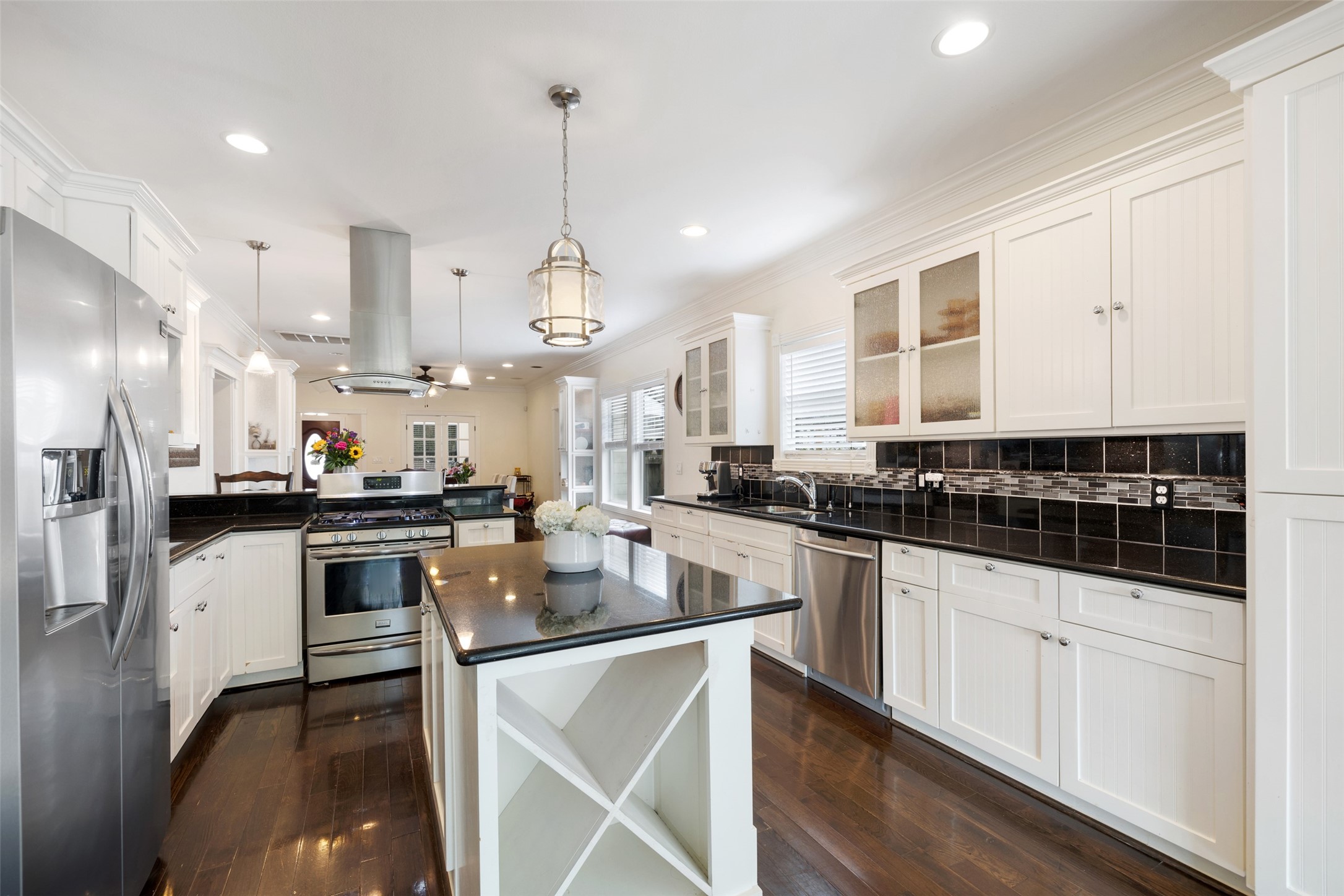 608 Jewett Street Houston, TX 77009 - Photo 10 of 23 a kitchen with stainless steel appliances a stove a sink a stove a refrigerator and cabinets