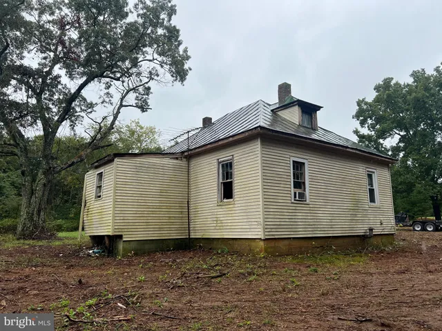 a side view of a house with a yard