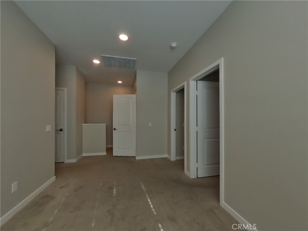 36591 Pepino Court Wildomar, CA 92595 - Photo 13 of 29 an empty room with closet and a bathroom