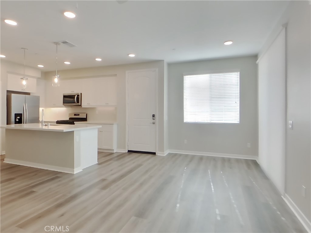 36591 Pepino Court Wildomar, CA 92595 - Photo 4 of 29 a view of kitchen with granite countertop cabinets and refrigerator