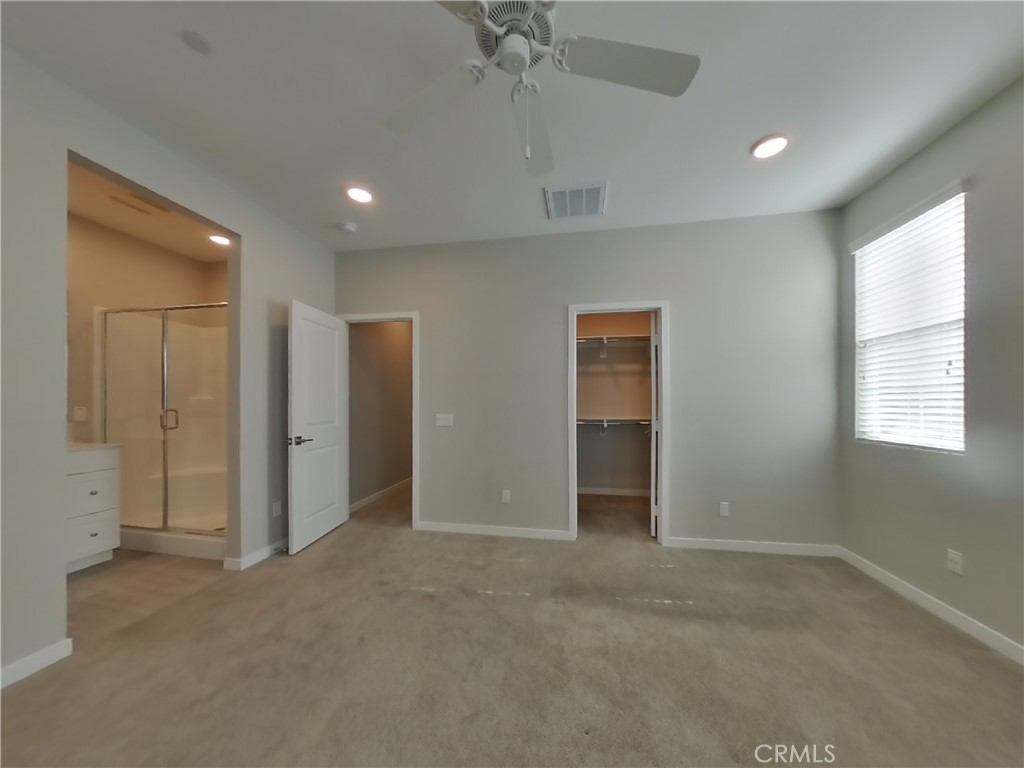 36591 Pepino Court Wildomar, CA 92595 - Photo 6 of 29 an empty room with fan and windows