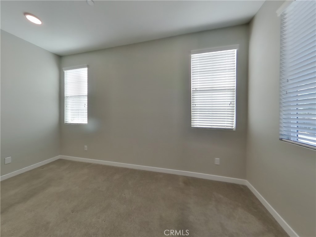 36591 Pepino Court Wildomar, CA 92595 - Photo 7 of 29 an empty room with windows
