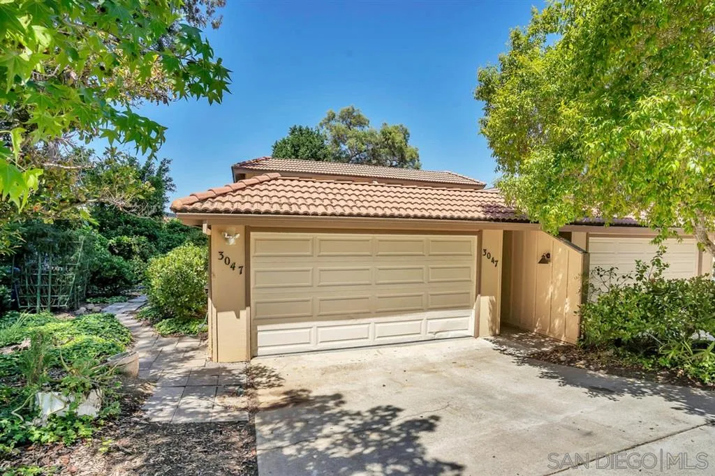 3047 Via De Caballo Encinitas, CA 92024 - Photo 1 of 25 a front view of a house with a garage