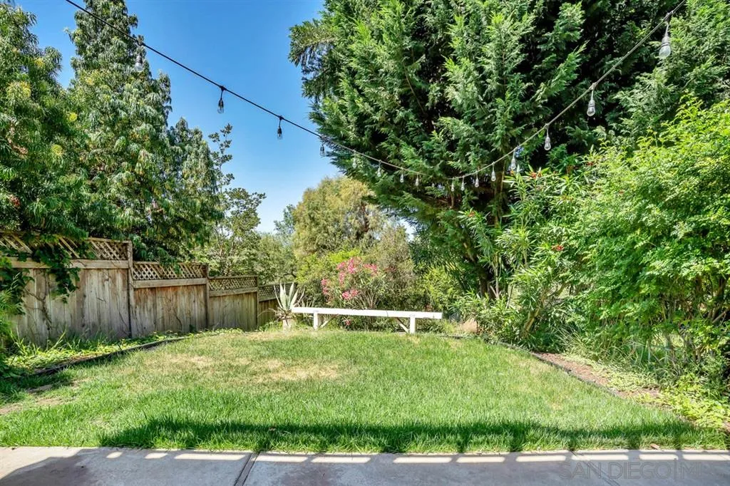 3047 Via De Caballo Encinitas, CA 92024 - Photo 11 of 25 a backyard of a house with lots of plants and tree