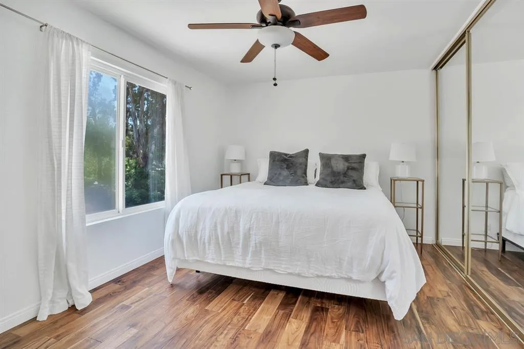 3047 Via De Caballo Encinitas, CA 92024 - Photo 20 of 25 a bedroom with a bed and a window