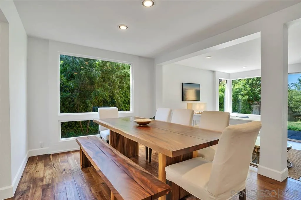 3047 Via De Caballo Encinitas, CA 92024 - Photo 7 of 25 a view of a dining room with furniture window and wooden floor