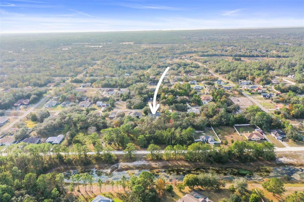 8412 Christopher Lane Weeki Wachee, FL 34613 - Photo 16 of 39 an aerial view of residential houses with outdoor space and trees