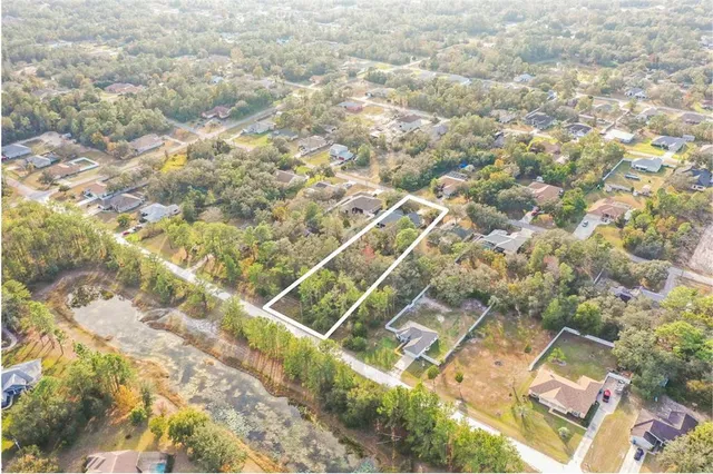 a bathroom with a double vanity sink mirror and shower