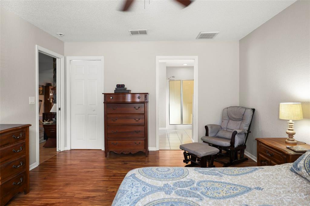 8412 Christopher Lane Weeki Wachee, FL 34613 - Photo 19 of 39 a living room with furniture and wooden floor