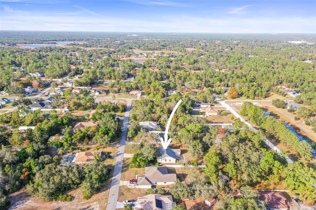 8412 Christopher Lane Weeki Wachee, FL 34613 - Photo 2 of 39 an aerial view of residential building with parking space