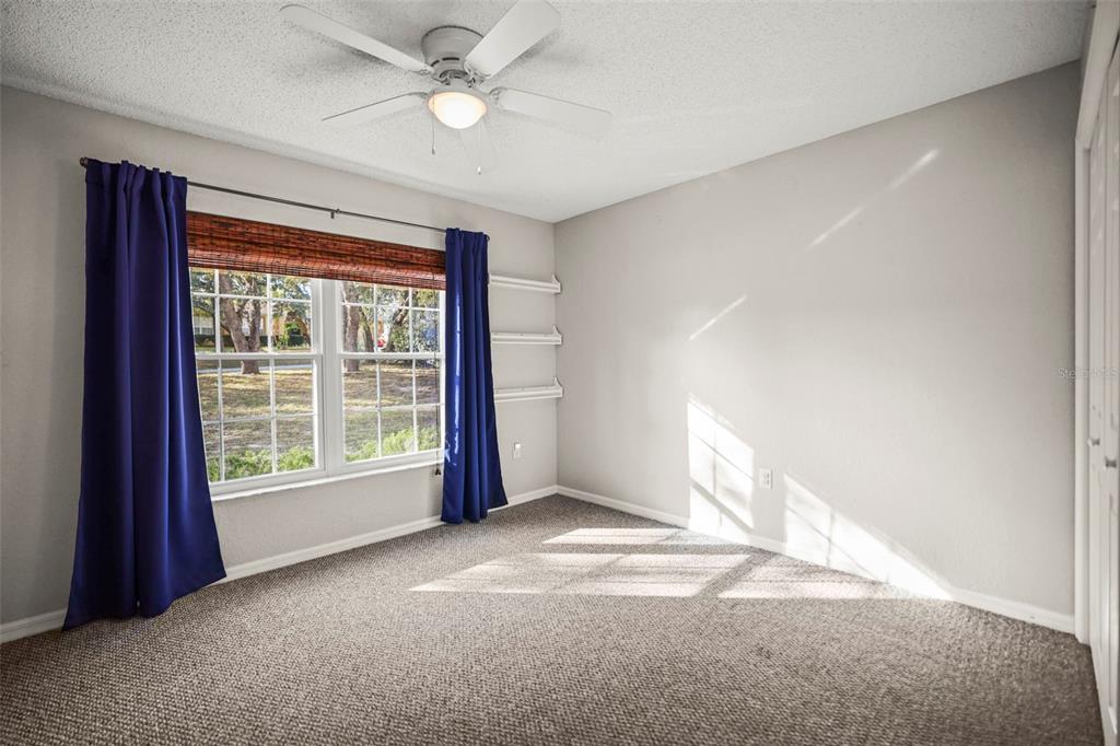 8412 Christopher Lane Weeki Wachee, FL 34613 - Photo 24 of 43 a view of an empty room with a window