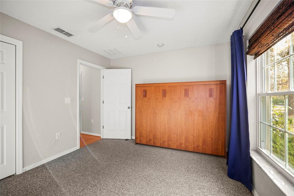 8412 Christopher Lane Weeki Wachee, FL 34613 - Photo 25 of 43 a view of an empty room with a window