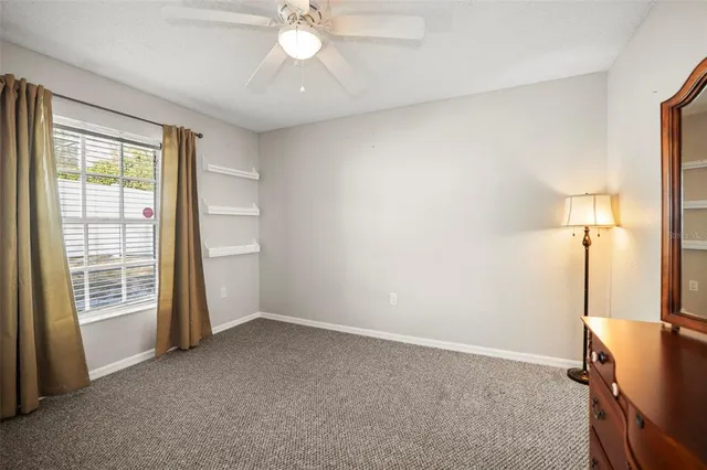 a kitchen with granite countertop cabinets a dining table and chairs