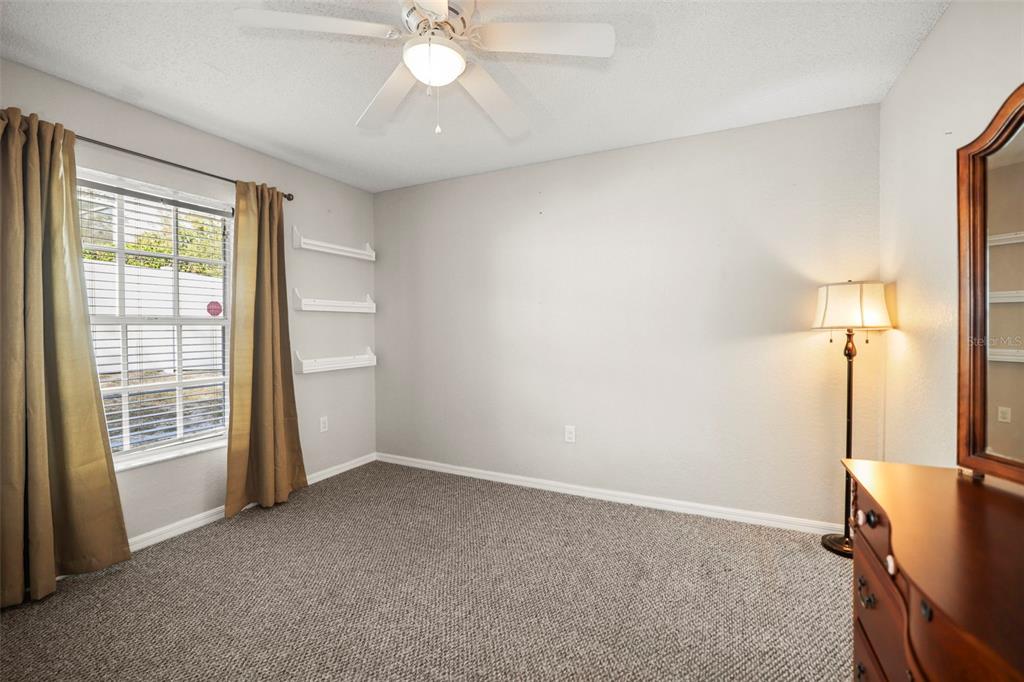8412 Christopher Lane Weeki Wachee, FL 34613 - Photo 27 of 43 a view of an empty room with a window