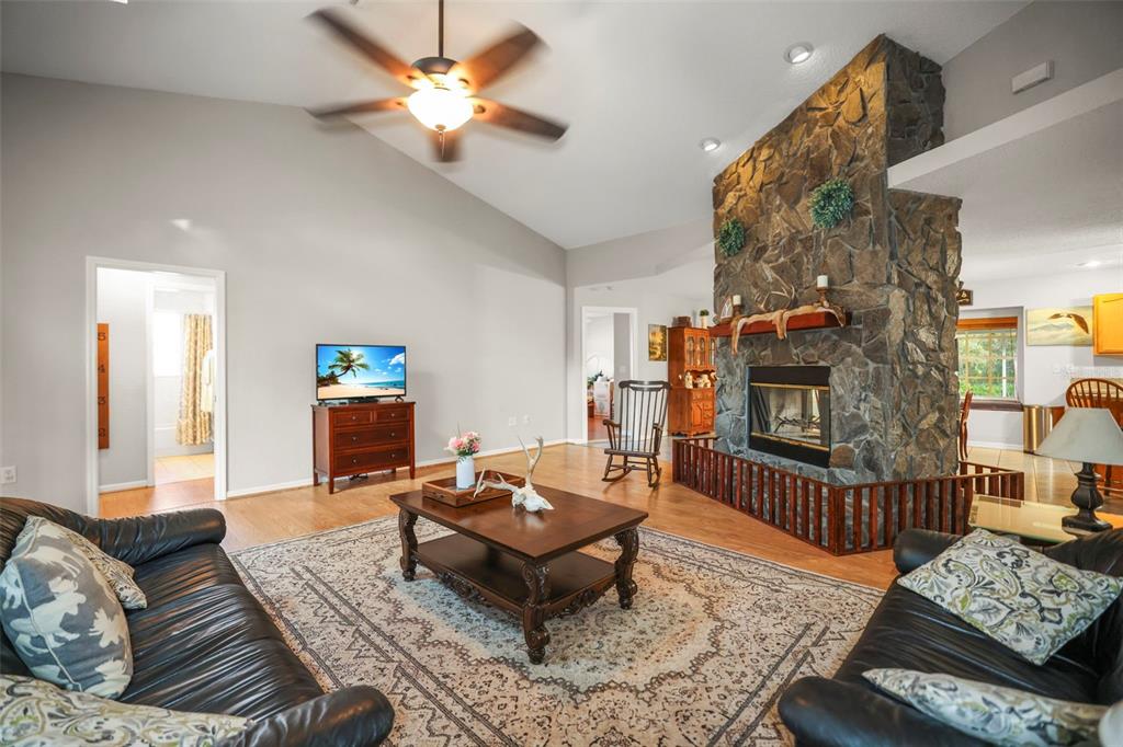8412 Christopher Lane Weeki Wachee, FL 34613 - Photo 5 of 39 a living room with furniture and a rug