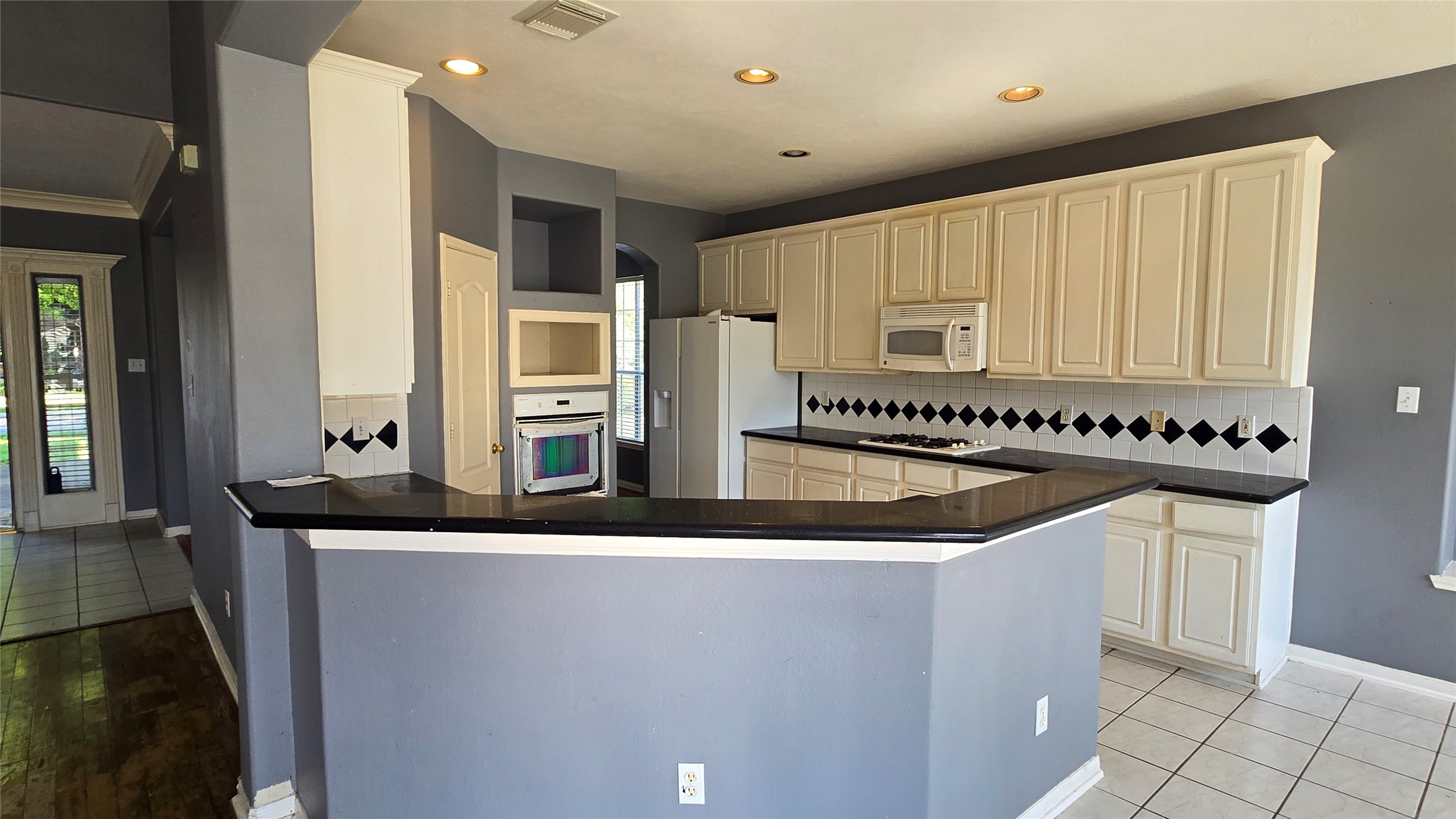 131 Annes Way Stafford, TX 77477 - Photo 8 of 25 a kitchen with stainless steel appliances granite countertop a sink and cabinets