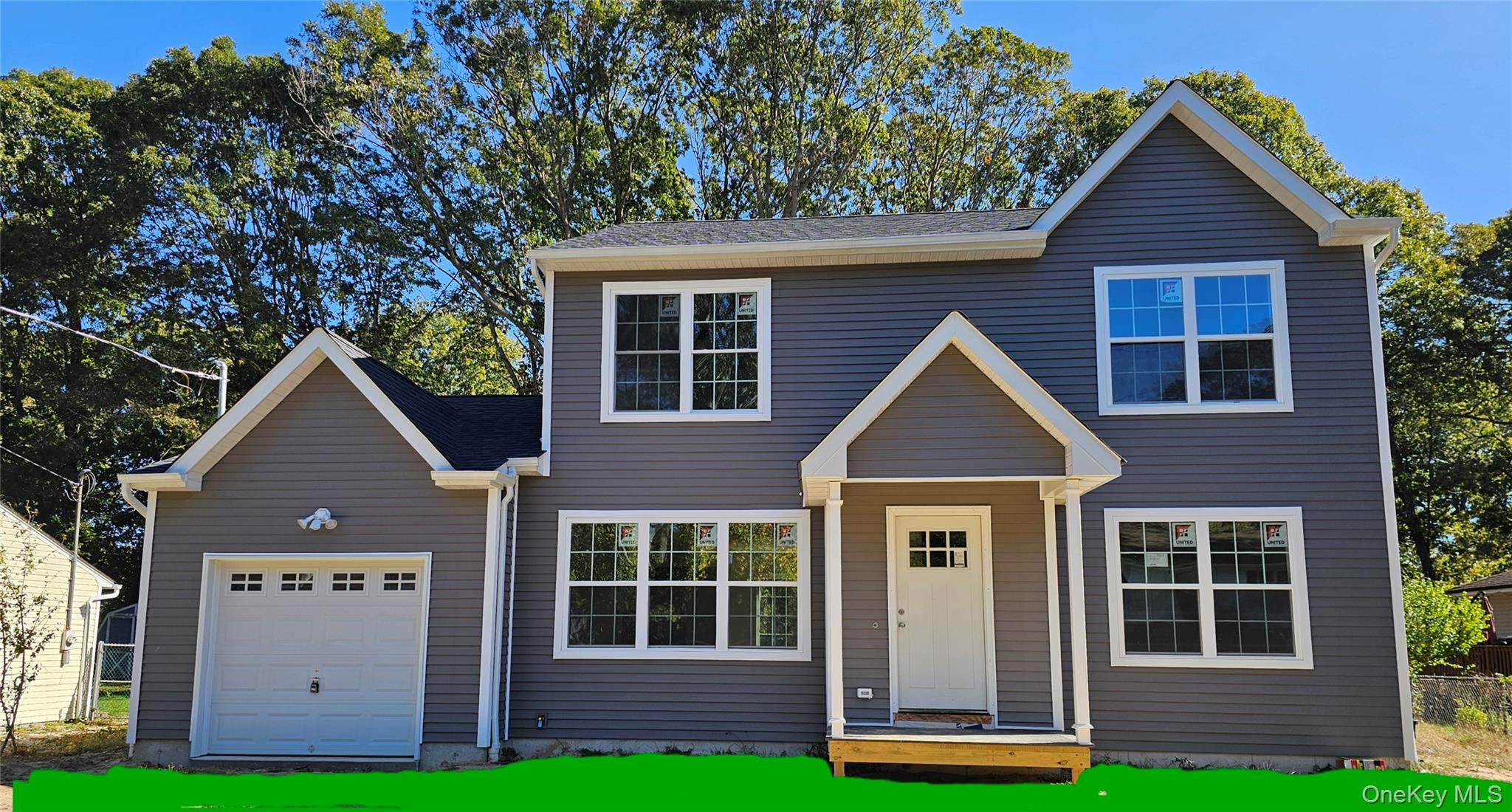 13 North Swezeytown Road Middle Island, NY 11953 - Photo 1 of 9 a front view of a house with a yard