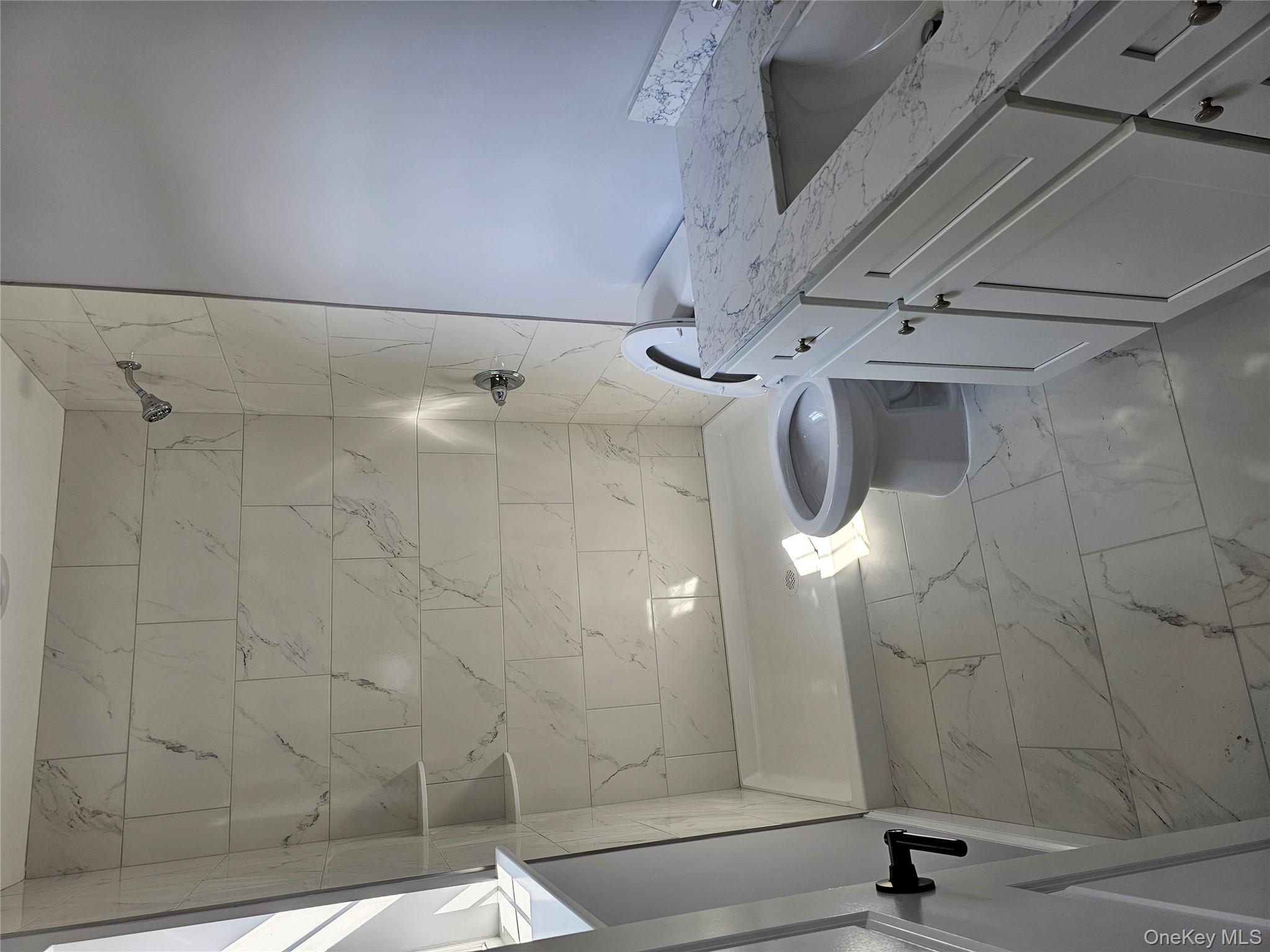 13 North Swezeytown Road Middle Island, NY 11953 - Photo 7 of 9 a bathroom with a granite countertop sink a toilet and shower