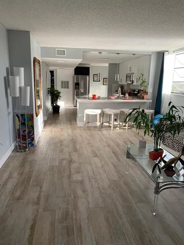 a bathroom with a bathtub sink and mirror