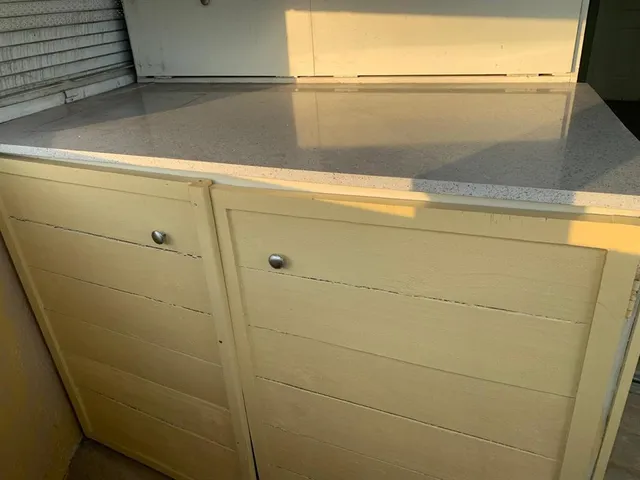 a view of a balcony with flower plants