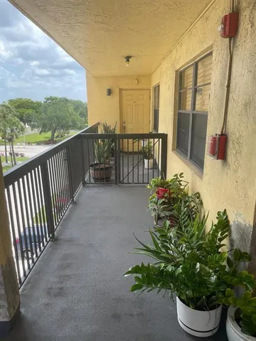 a view of a porch with furniture