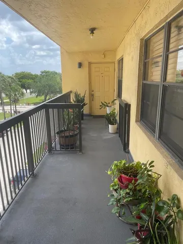 a view of house with outdoor space and swimming pool