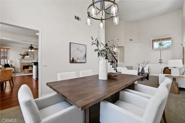 a view of a bedroom with wooden floor and bed