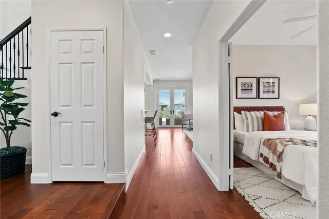 a living room with furniture a fireplace and a floor to ceiling window